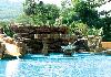 Fun swimming pool with waterslide, jacuzzi and fountain